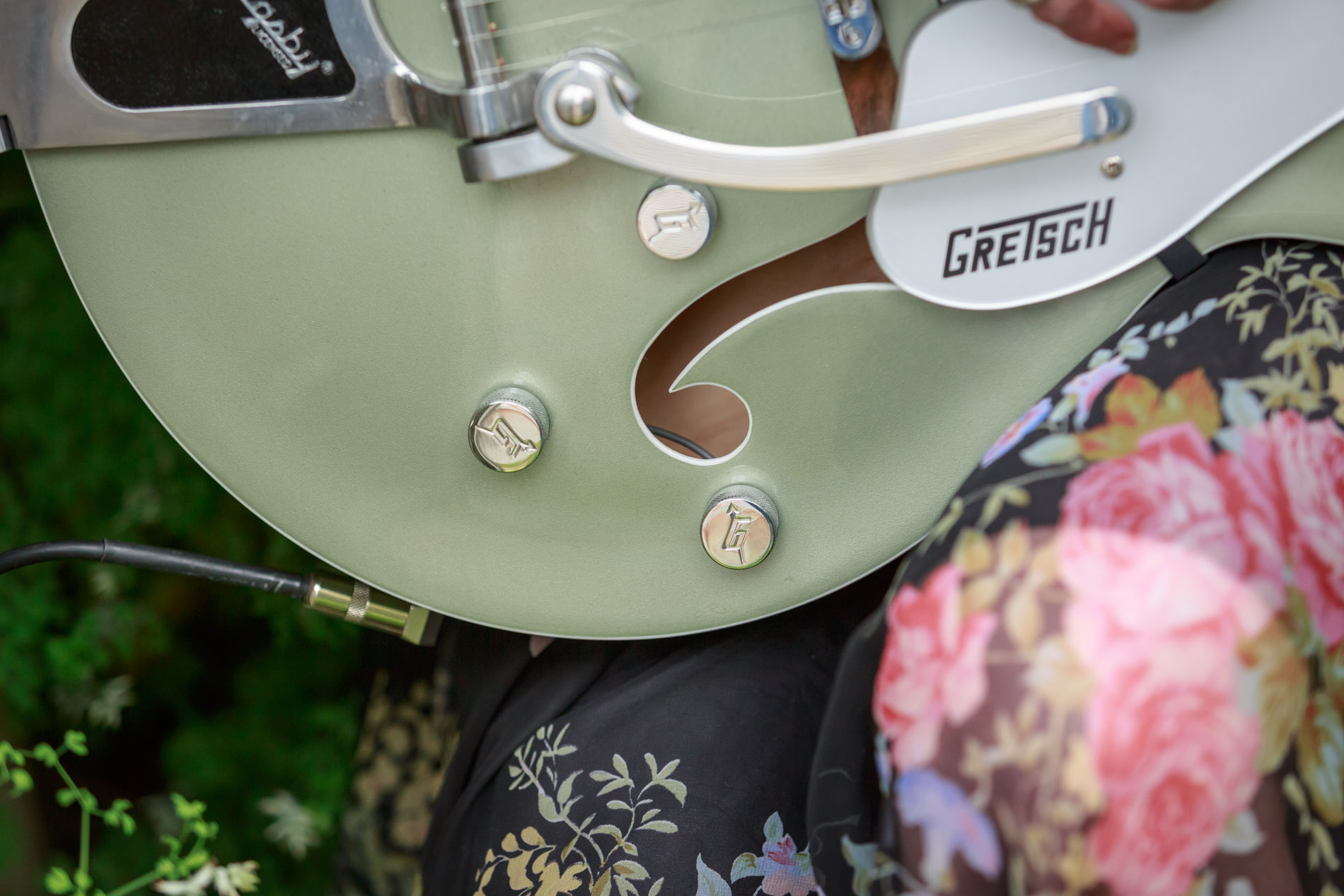 green Gretsch electric guitar close up 