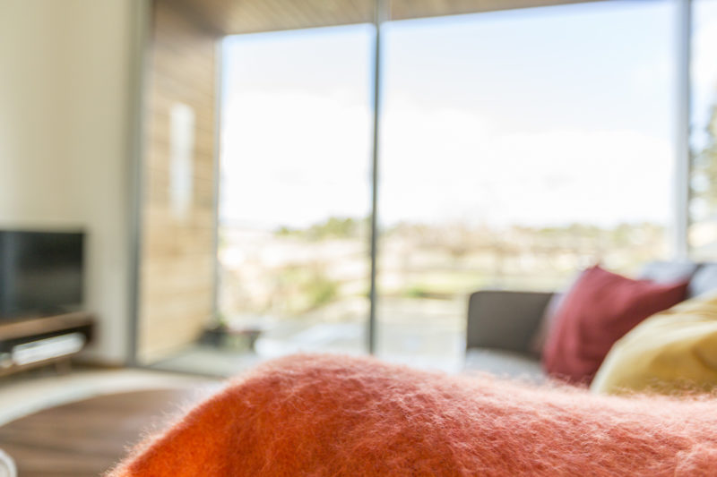 Airbnb Photography soft orange woollen blanket interior design